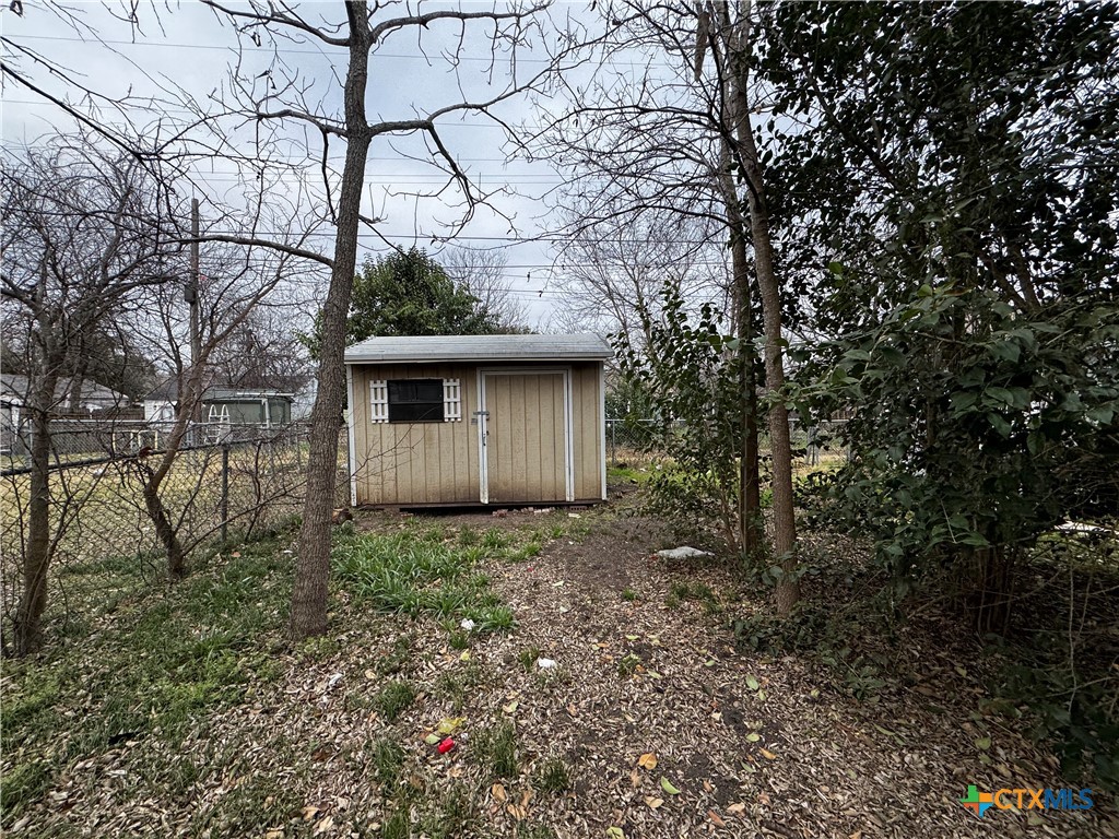 1010 South 17th Street Temple, TX 76504 - Photo 27 of 30 a view of a house with a tree in the forest
