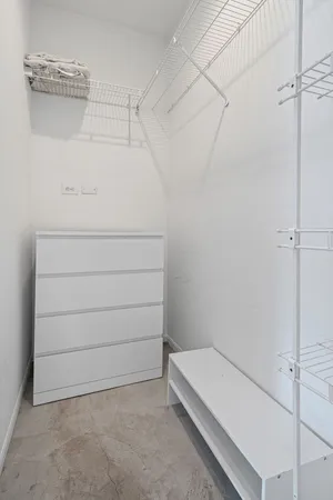 a view of an empty walk in closet