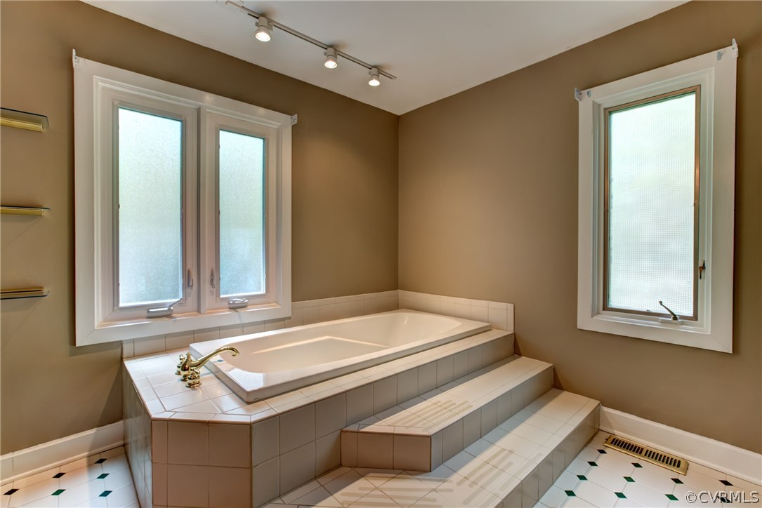 2441 Camelback Road Richmond, VA 23236 - Photo 16 of 36 a bathroom with a sink and a mirror