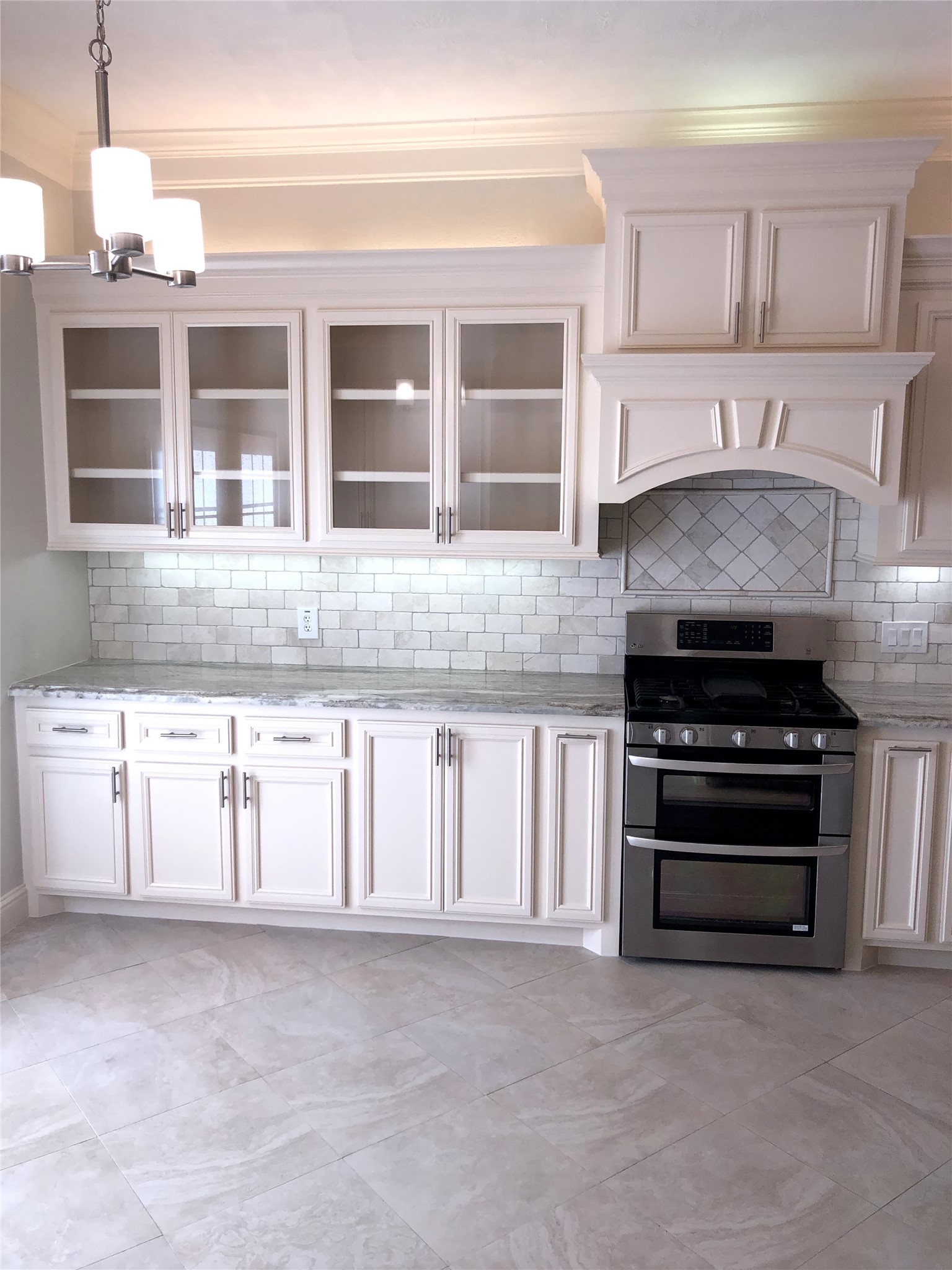 10310 Chevy Chase Drive Houston, TX 77042 - Photo 11 of 36 a kitchen with granite countertop a stove and a sink
