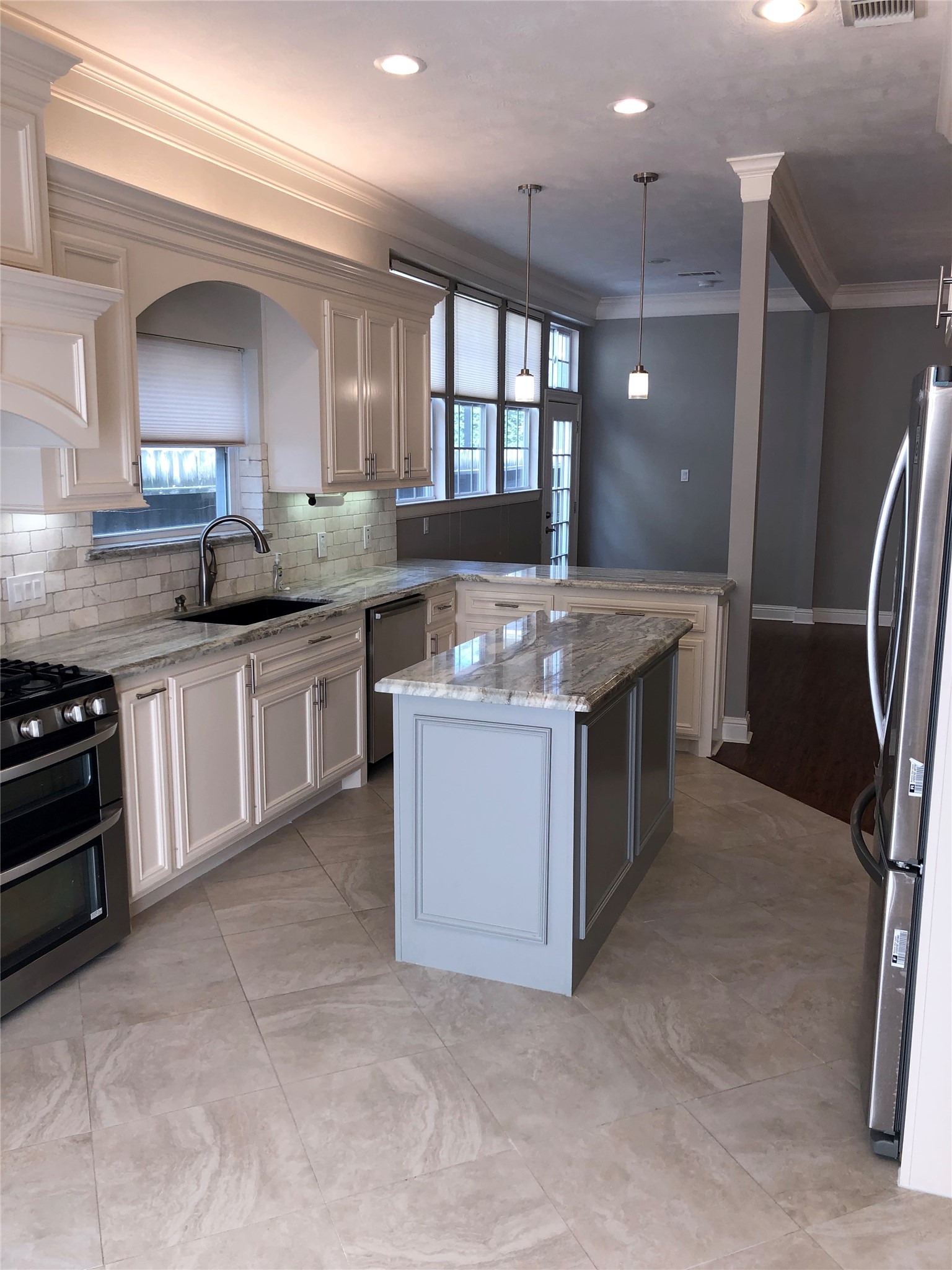 10310 Chevy Chase Drive Houston, TX 77042 - Photo 12 of 36 a kitchen with stainless steel appliances granite countertop a stove a sink and a refrigerator
