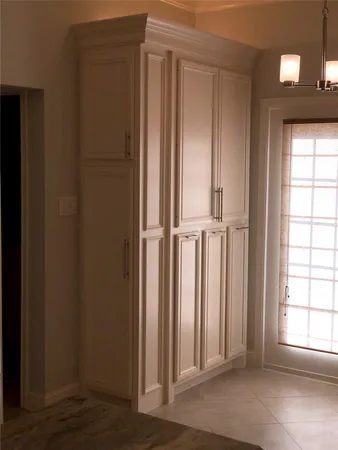 an entryway with wooden floor