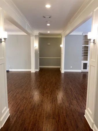 a view of hallway with wooden floor