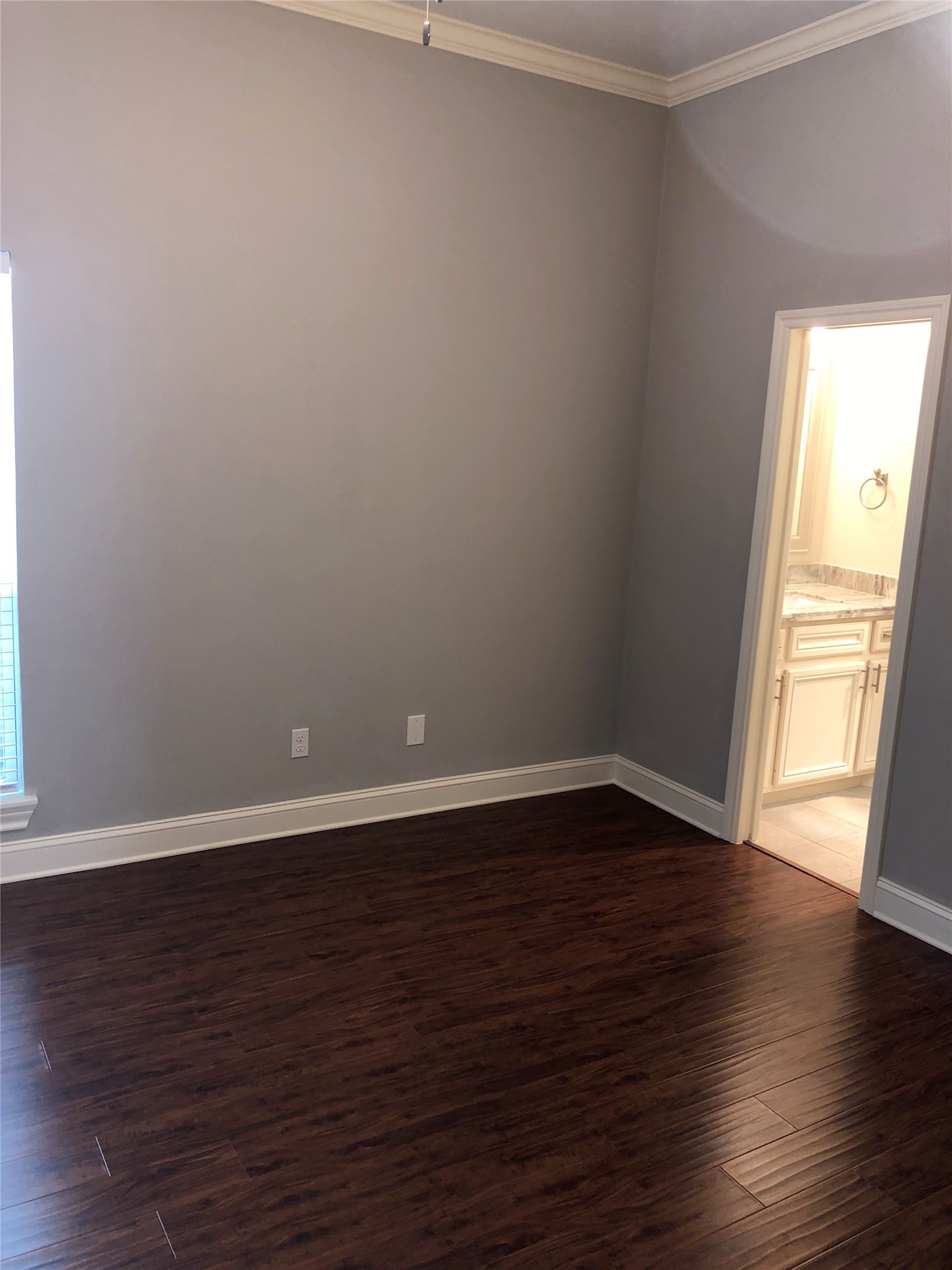 10310 Chevy Chase Drive Houston, TX 77042 - Photo 30 of 36 a view of an empty room and wooden floor and a window