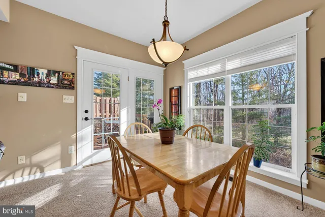 a view of balcony with furniture and umbrella