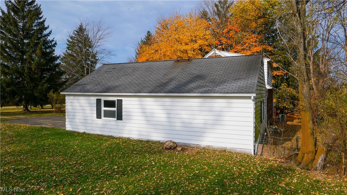 10078 Ellsworth Road Hudson, OH 44236 - Photo 31 of 34 View of property exterior with a lawn