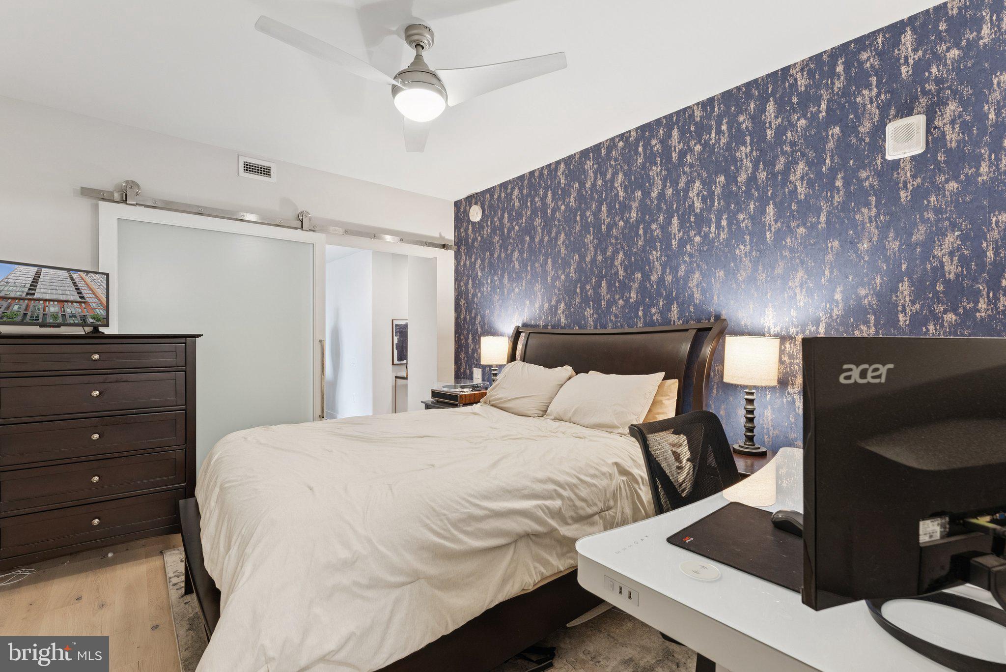 1211 Van Street Southeast, Unit 913 Washington, DC 20003 - Photo 13 of 38 a bedroom with a bed and a desk