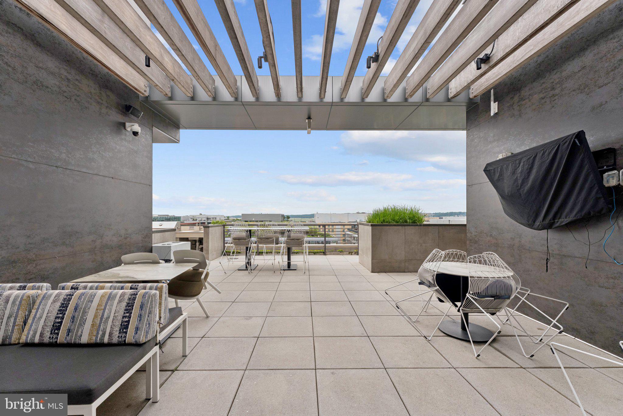1211 Van Street Southeast, Unit 913 Washington, DC 20003 - Photo 17 of 38 a living room with a couch and a table