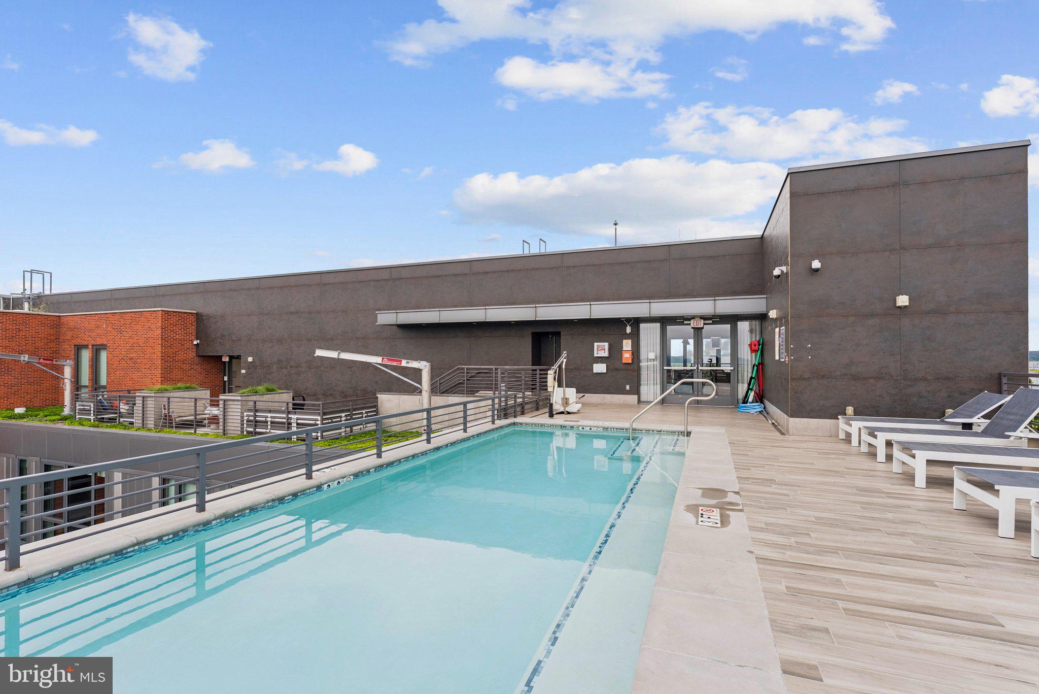1211 Van Street Southeast, Unit 913 Washington, DC 20003 - Photo 21 of 38 a view of a swimming pool with a patio