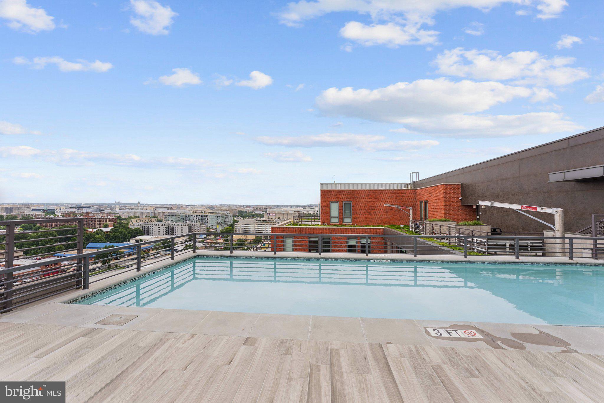 1211 Van Street Southeast, Unit 913 Washington, DC 20003 - Photo 23 of 38 a view of a swimming pool and a yard
