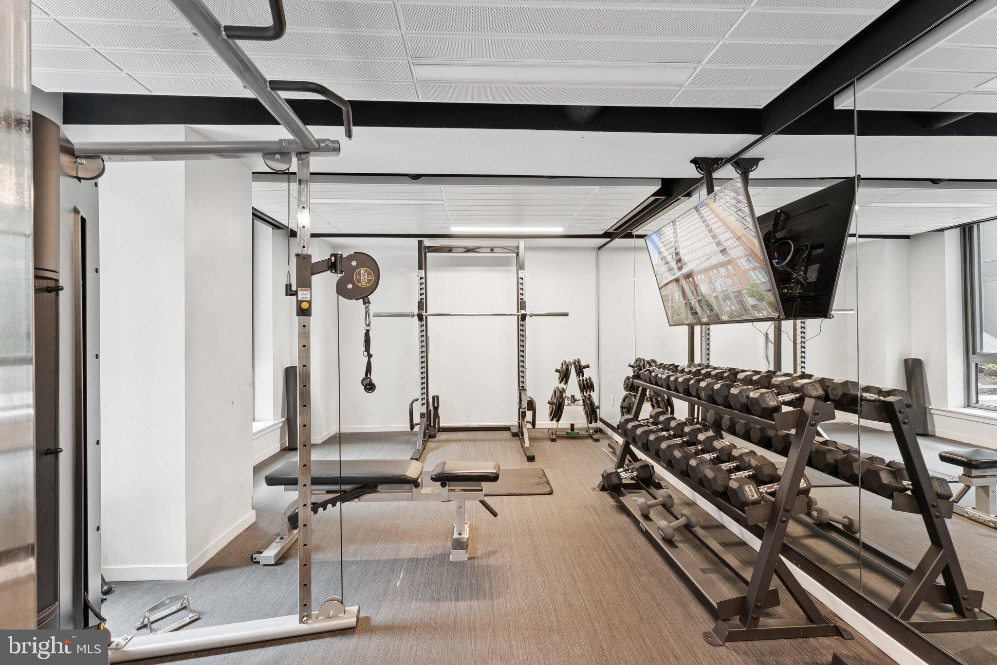 1211 Van Street Southeast, Unit 913 Washington, DC 20003 - Photo 25 of 38 a room with gym equipment