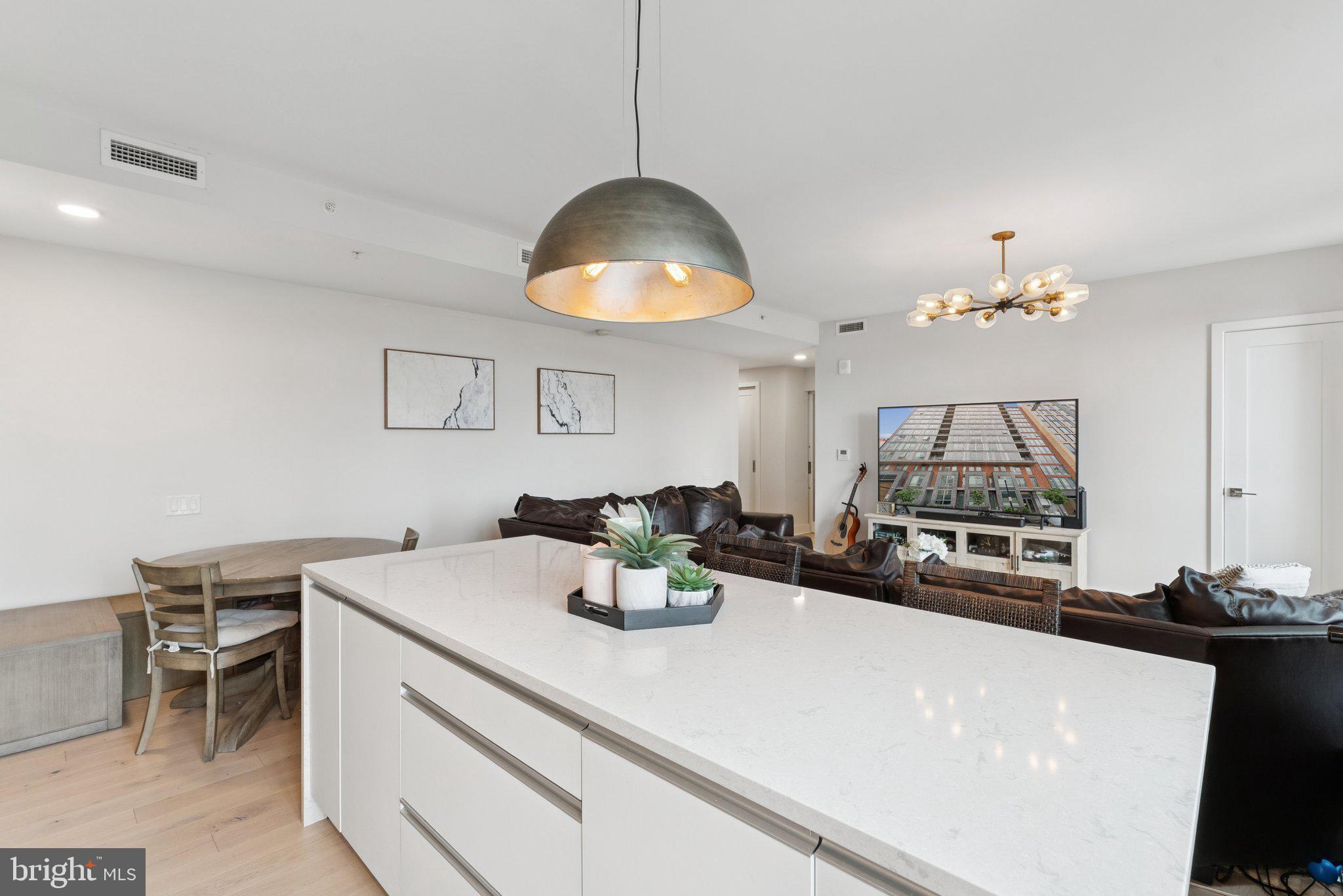 1211 Van Street Southeast, Unit 913 Washington, DC 20003 - Photo 9 of 38 a kitchen with a table and chairs