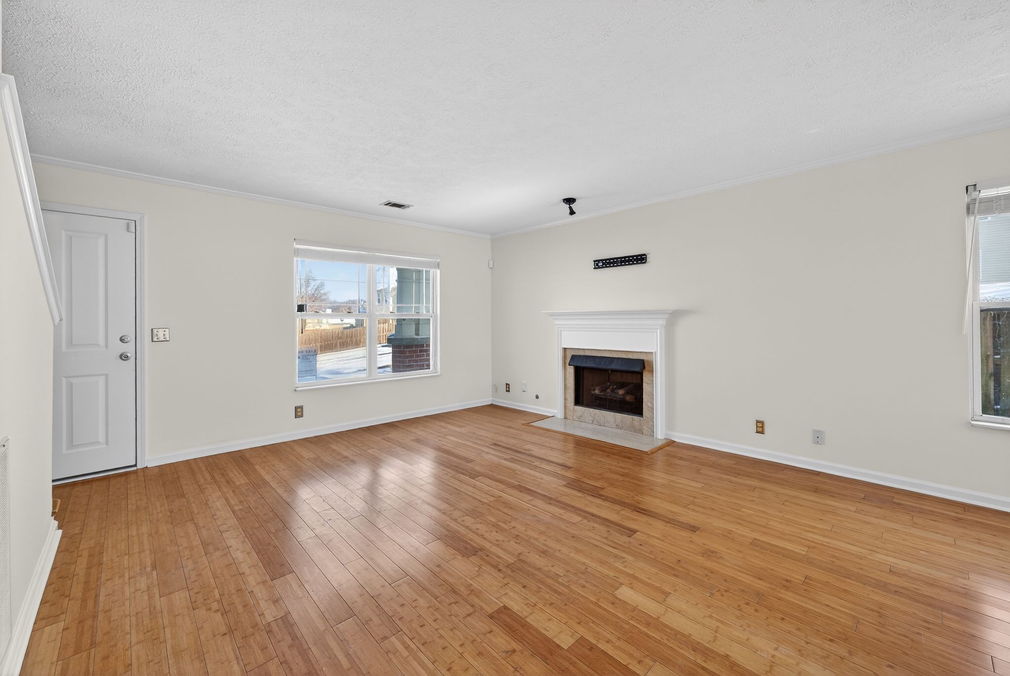 7205 Explorer Trail Nashville, TN 37221 - Photo 6 of 30 a view of empty room with wooden floor and fireplace