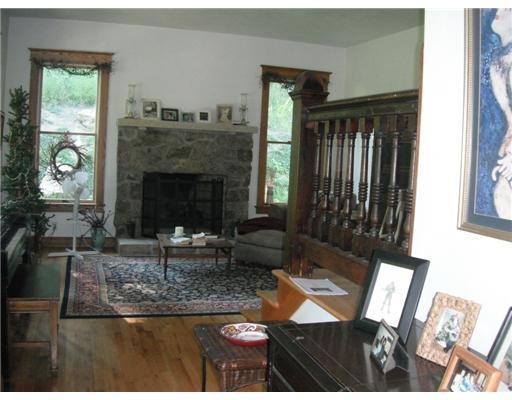 555 New Texas Road Plum, PA 15239 - Photo 2 of 18 Living Room. Beautiful hardwood floors are just one of the many features offered in this custom built home. The stone fireplace is one of three that are located throughout.