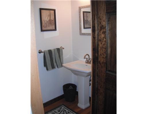 555 New Texas Road Plum, PA 15239 - Photo 11 of 18 Other. Half bath off gameroom features hardwood flooring and pedestal sink.