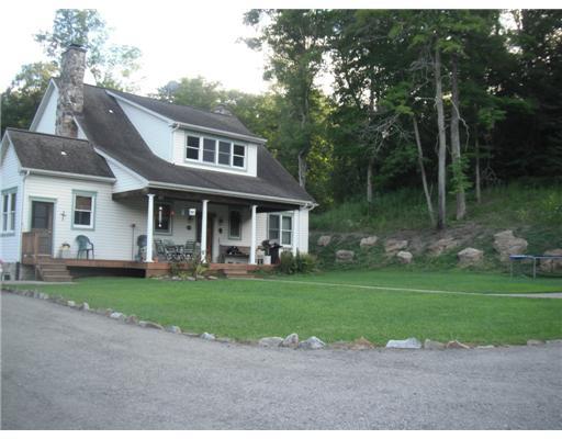555 New Texas Road Plum, PA 15239 - Photo 15 of 18 Exterior Back. The rear porch overlooks the yard which is a great place for picnics and get-togethers.
