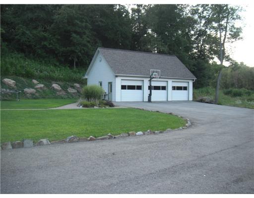 555 New Texas Road Plum, PA 15239 - Photo 17 of 18 Parking Lot/Garage. This extra large three car heated garage has plenty of room for storage and can accommodate oversize vehicles. Asphalt driveway has parking for numerous vehicles when hosting family gatherings.
