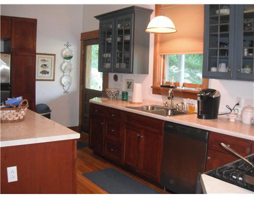 555 New Texas Road Plum, PA 15239 - Photo 4 of 18 Kitchen. Plenty of counter and storage space. The back door in the kitchen leads to the rear porch, yard and garage.