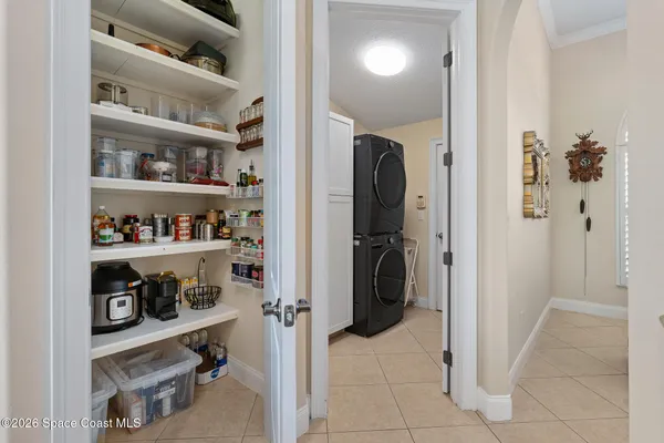a kitchen with lots of wooden furniture and breakfast area