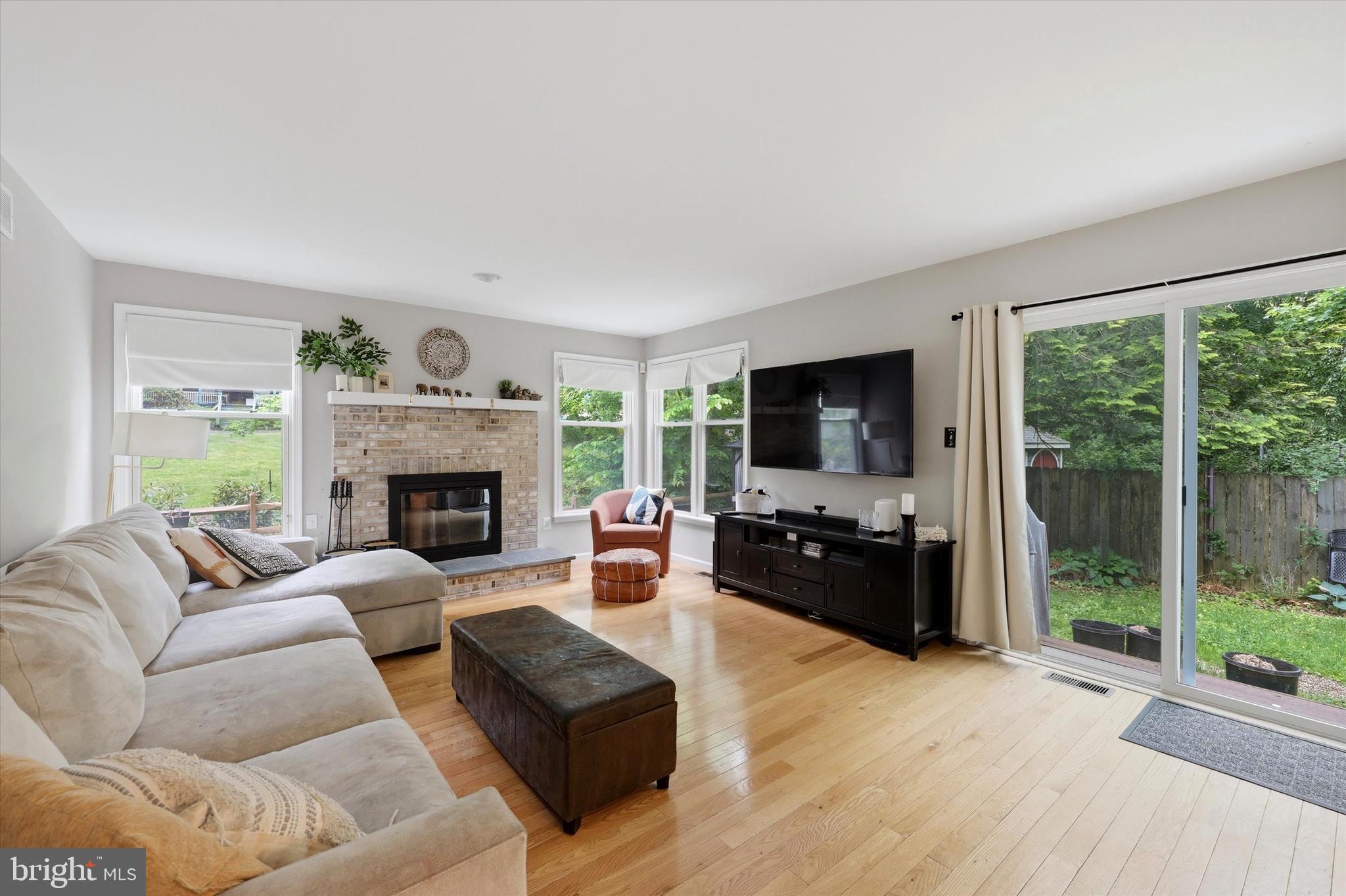 320 Maple Avenue Wyncote, PA 19095 - Photo 10 of 28 a living room with furniture a flat screen tv and a fireplace