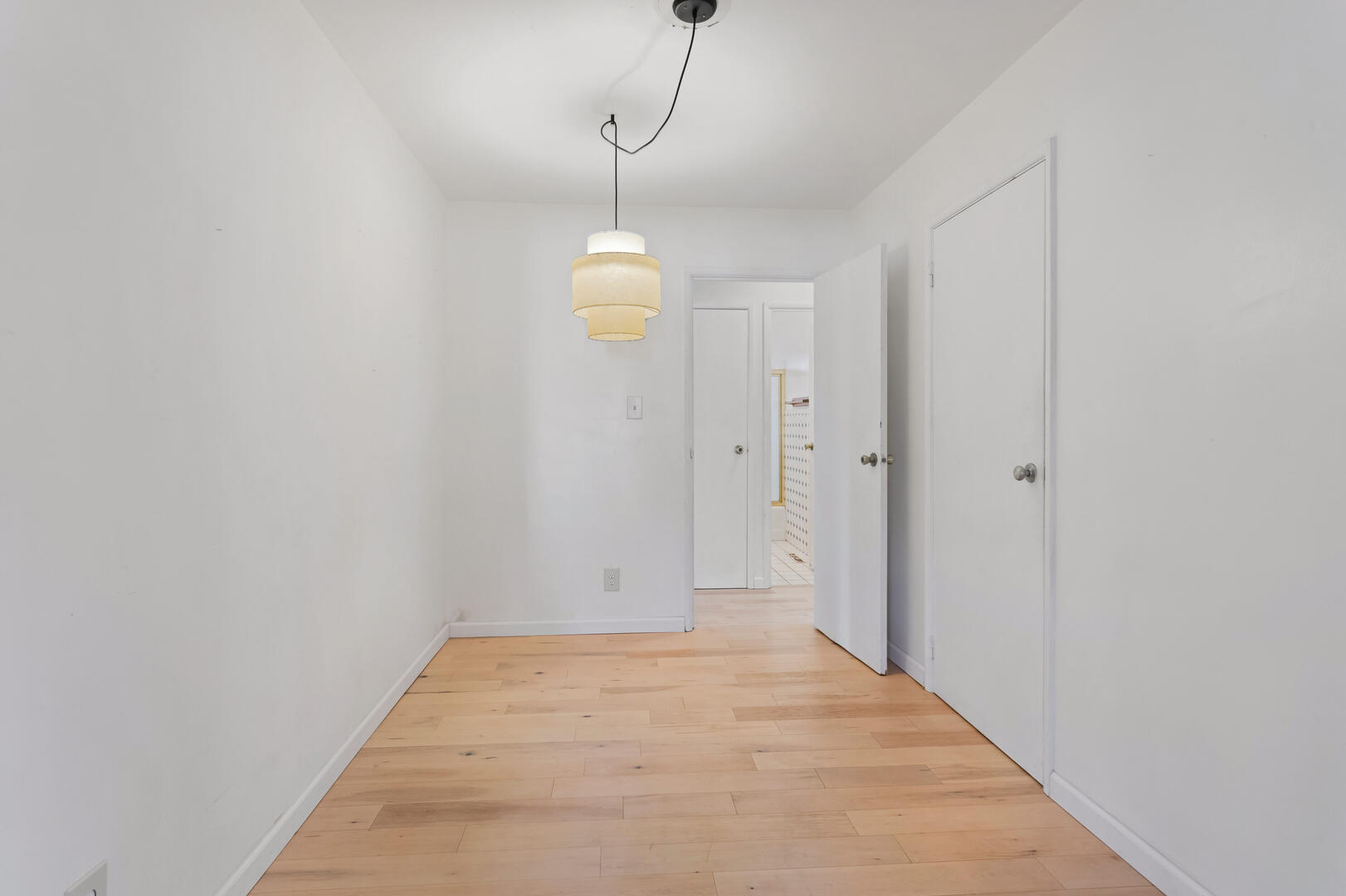 1709 Crescent Drive Champaign, IL 61821 - Photo 11 of 27 a view of a room with wooden floor and white walls