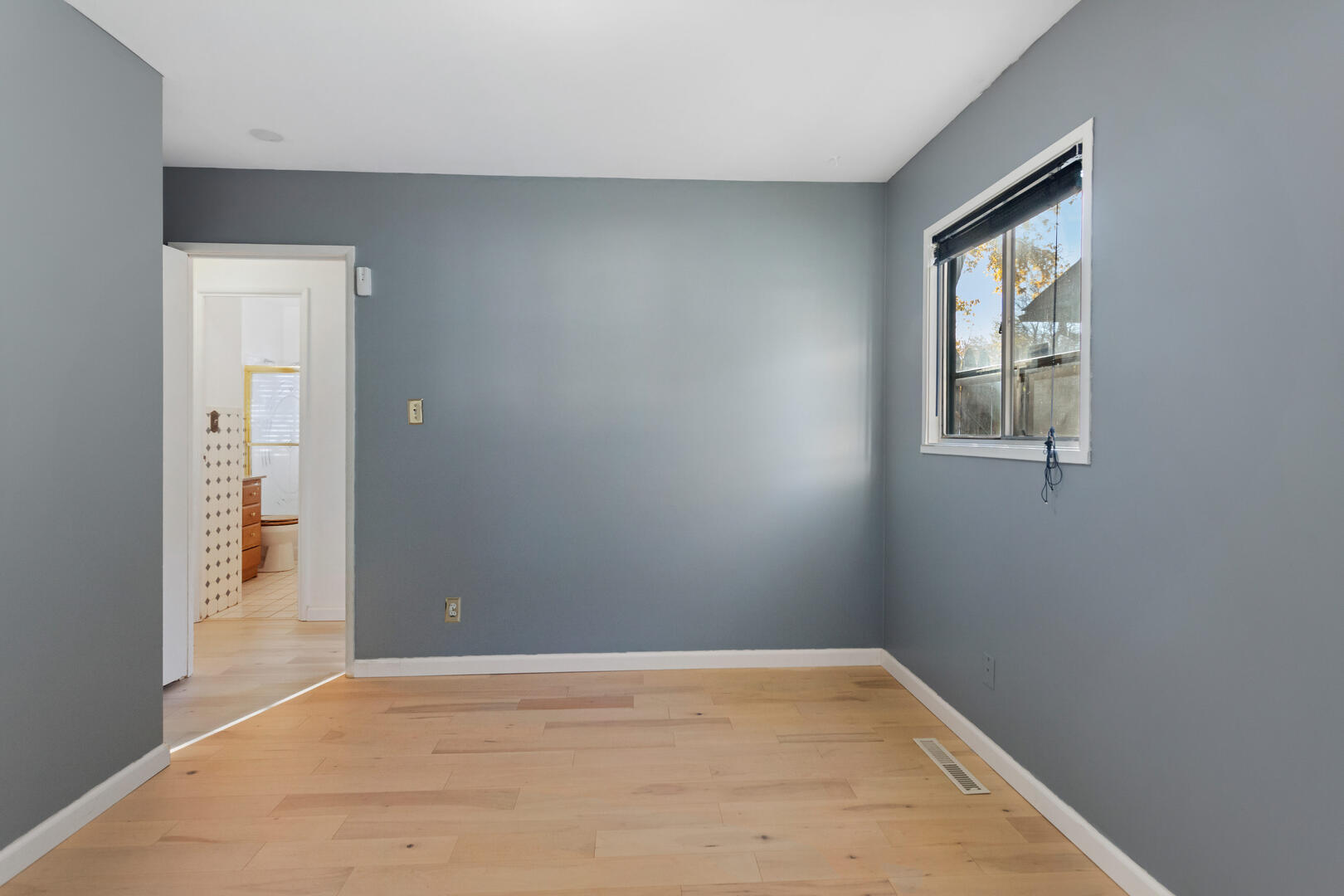 1709 Crescent Drive Champaign, IL 61821 - Photo 13 of 27 an empty room with windows and closet