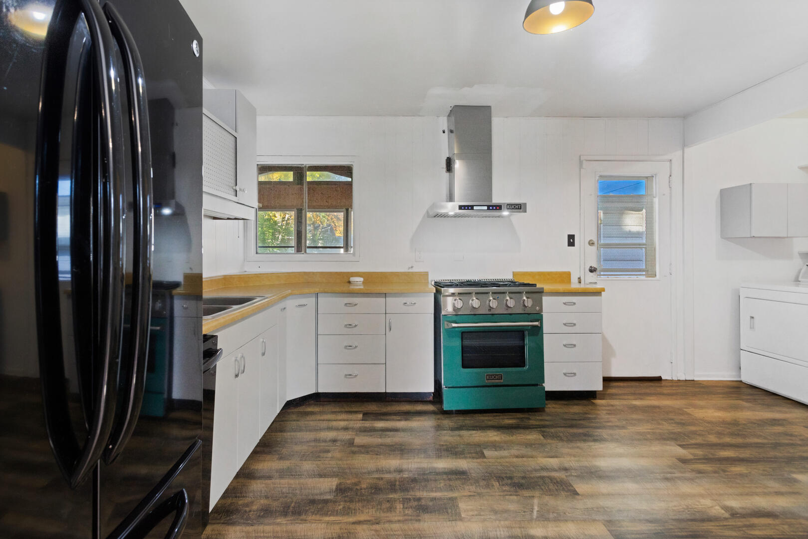 1709 Crescent Drive Champaign, IL 61821 - Photo 5 of 27 a kitchen with granite countertop a stove and a sink