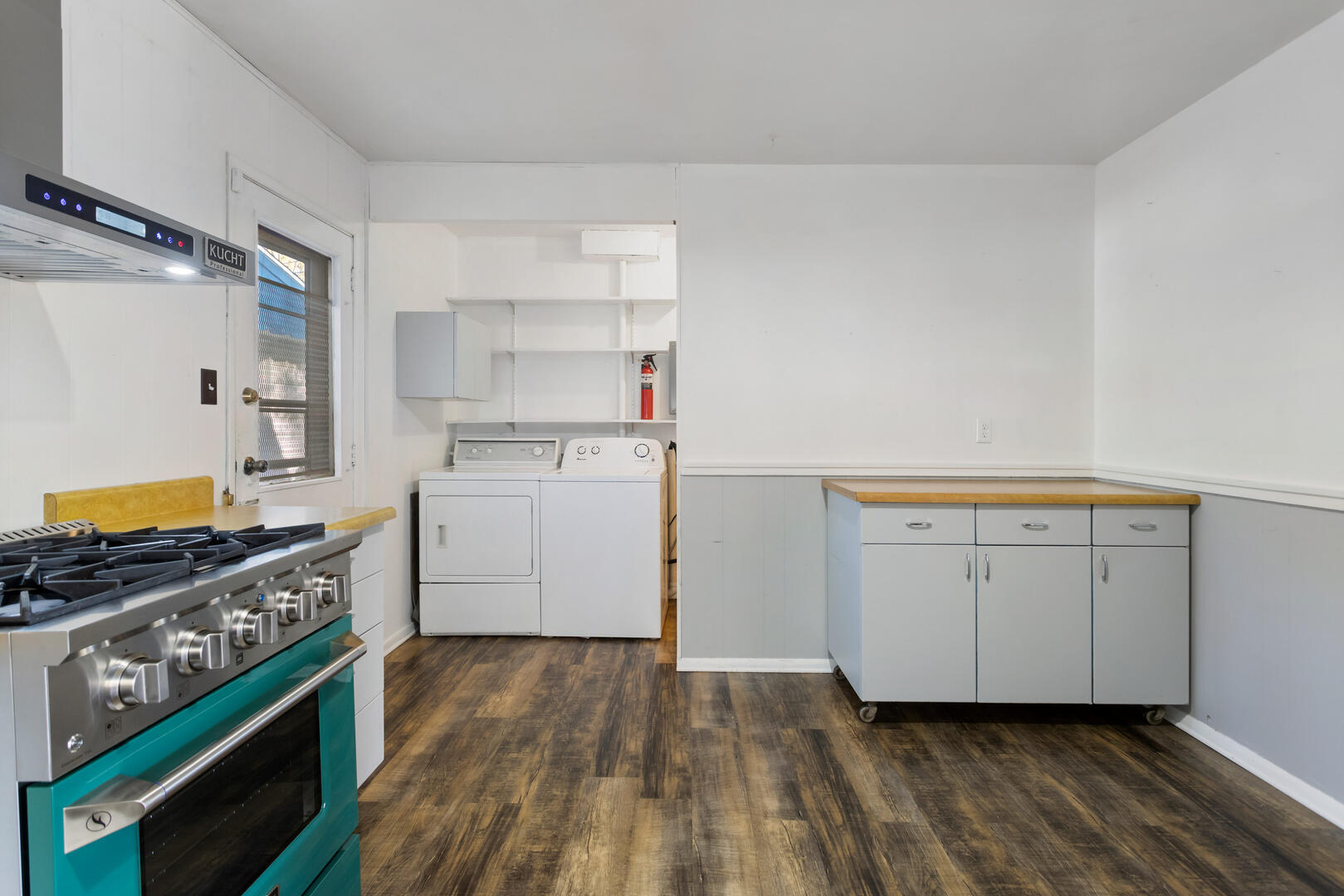 1709 Crescent Drive Champaign, IL 61821 - Photo 6 of 27 a kitchen with cabinets and wooden floor