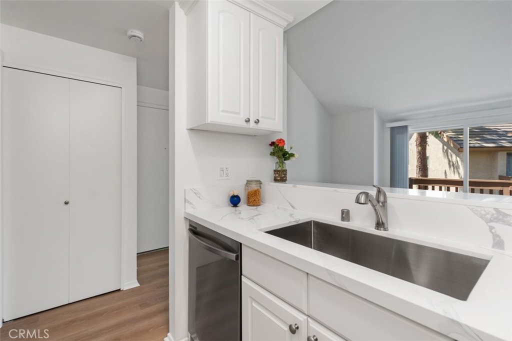 89 Lemon Grove Irvine, CA 92618 - Photo 12 of 34 a kitchen with a sink and cabinets