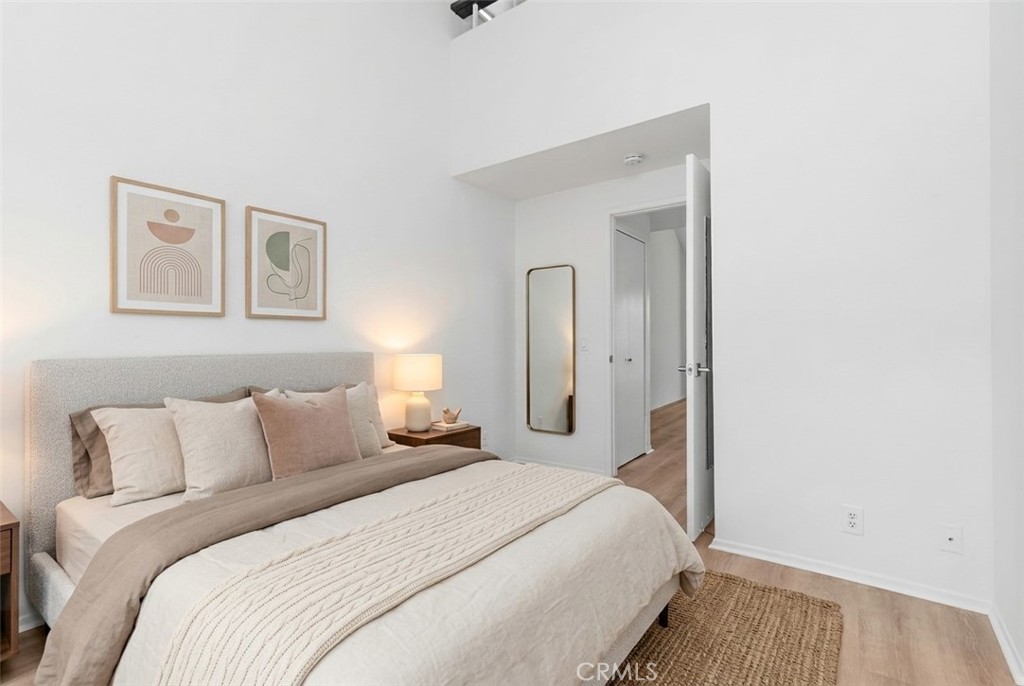 89 Lemon Grove Irvine, CA 92618 - Photo 15 of 34 a bedroom with a bed and a mirror