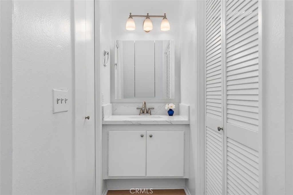 89 Lemon Grove Irvine, CA 92618 - Photo 16 of 34 a bathroom with a sink and a mirror