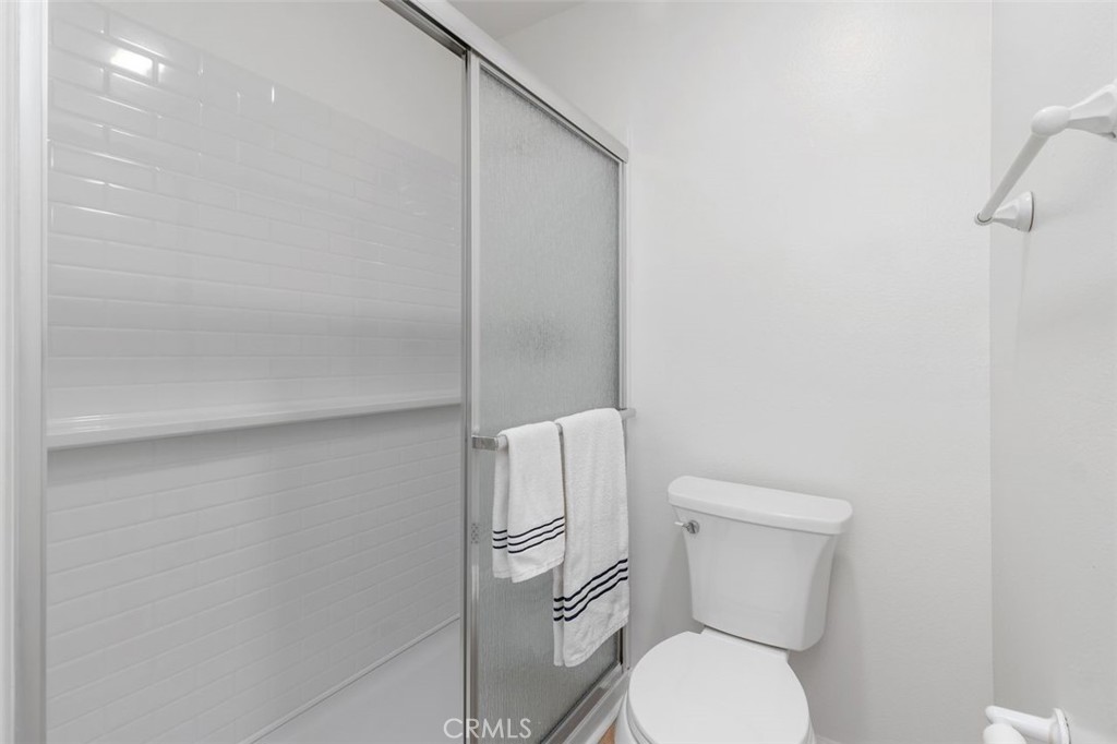 89 Lemon Grove Irvine, CA 92618 - Photo 17 of 34 a white toilet sitting next to a shower