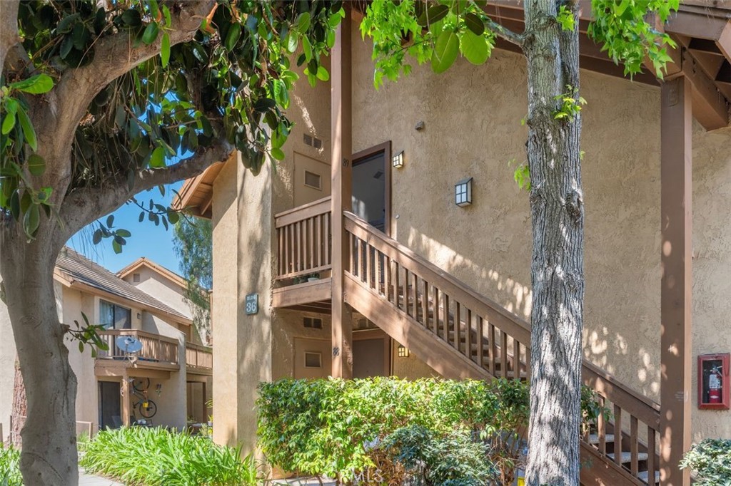 89 Lemon Grove Irvine, CA 92618 - Photo 2 of 34 a view of a house with a yard