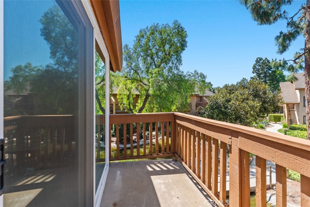 89 Lemon Grove Irvine, CA 92618 - Photo 25 of 34 a view of a balcony with a tree