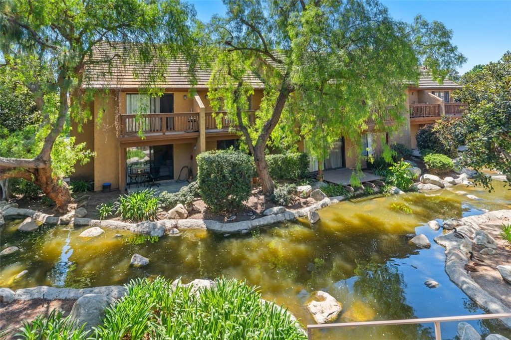 89 Lemon Grove Irvine, CA 92618 - Photo 27 of 34 a view of swimming pool with a garden