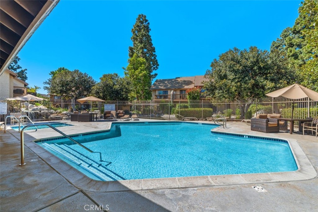 89 Lemon Grove Irvine, CA 92618 - Photo 29 of 34 a view of a swimming pool with a lounge chair