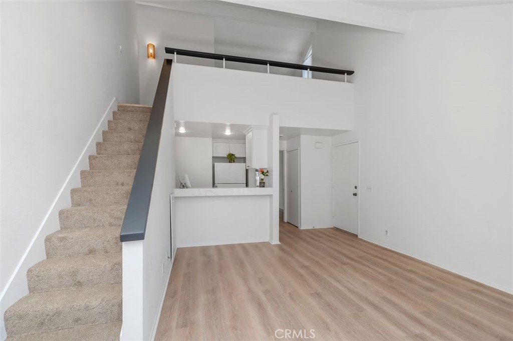 89 Lemon Grove Irvine, CA 92618 - Photo 34 of 34 a view of a big room with wooden floor and windows