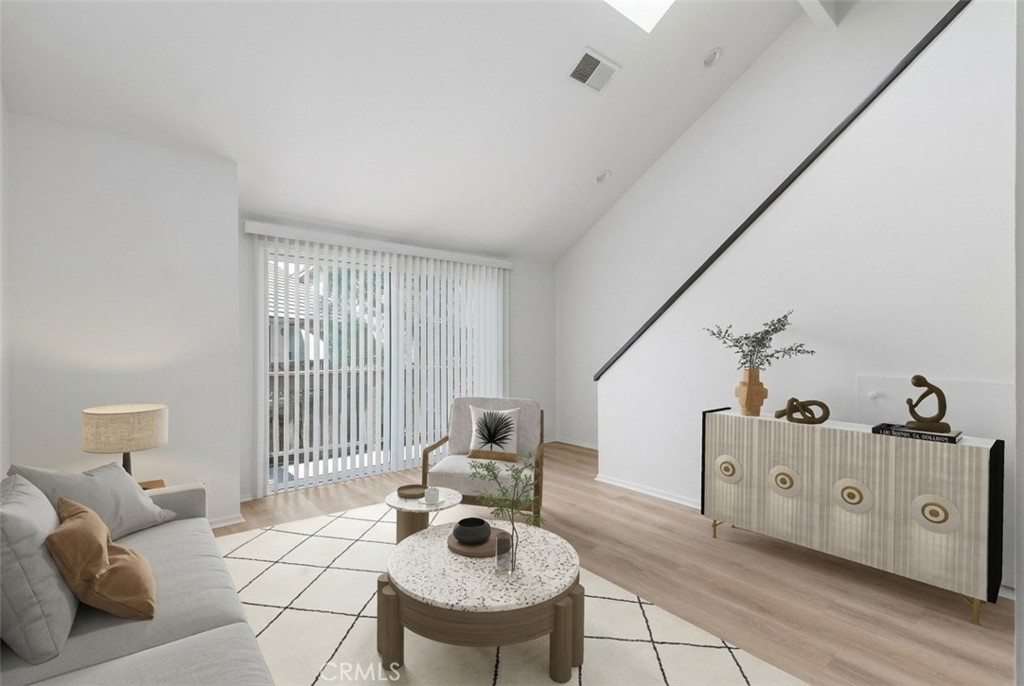 89 Lemon Grove Irvine, CA 92618 - Photo 5 of 34 a living room with furniture and wooden floor