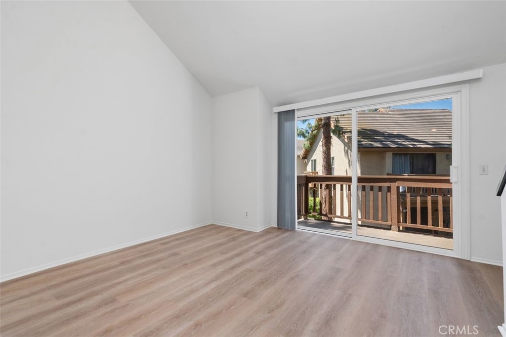 89 Lemon Grove Irvine, CA 92618 - Photo 7 of 34 a view of an empty room with wooden floor