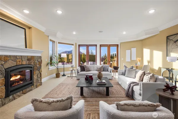 a living room with furniture and view of kitchen