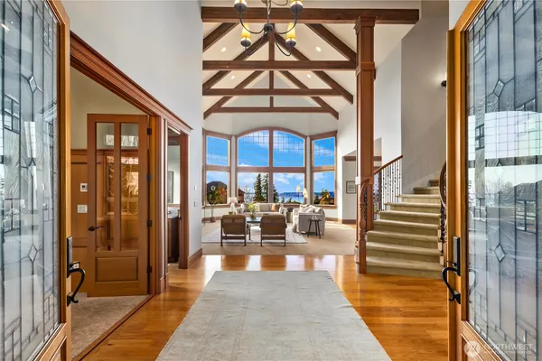 a lobby with furniture and floor to ceiling window