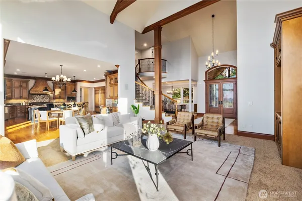 a living room with fireplace furniture and a large window