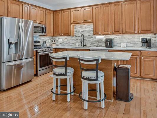 3515 Cromarty Lane Edgewater, MD 21037 - Photo 11 of 53 a kitchen with granite countertop wooden floors and stainless steel appliances