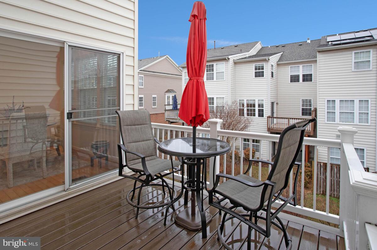 3515 Cromarty Lane Edgewater, MD 21037 - Photo 18 of 53 a table and chairs in front of a house