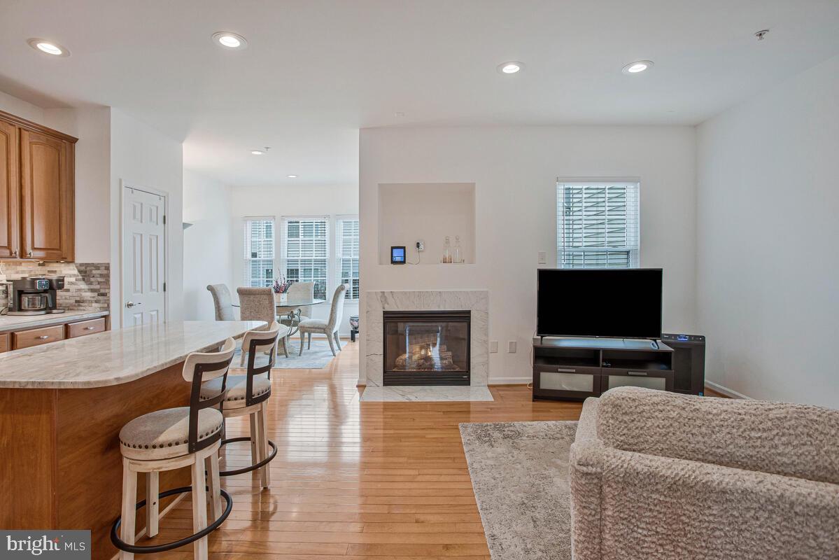 3515 Cromarty Lane Edgewater, MD 21037 - Photo 20 of 53 a living room with furniture a fireplace and a flat screen tv