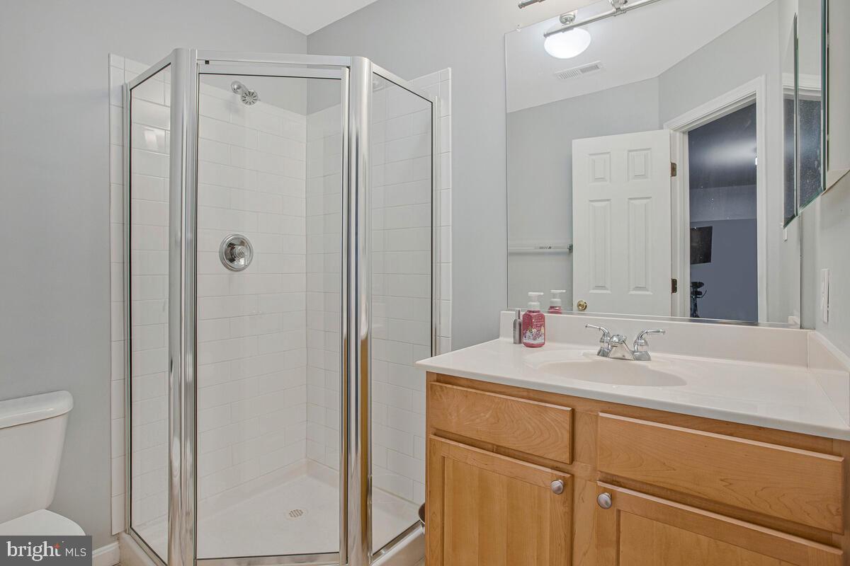 3515 Cromarty Lane Edgewater, MD 21037 - Photo 42 of 53 a bathroom with a sink and a mirror