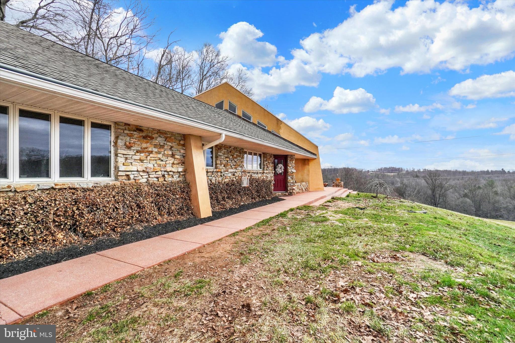 8272 Woodbine Road Airville, PA 17302 - Photo 11 of 68 a view of a house with a large tree and a yard