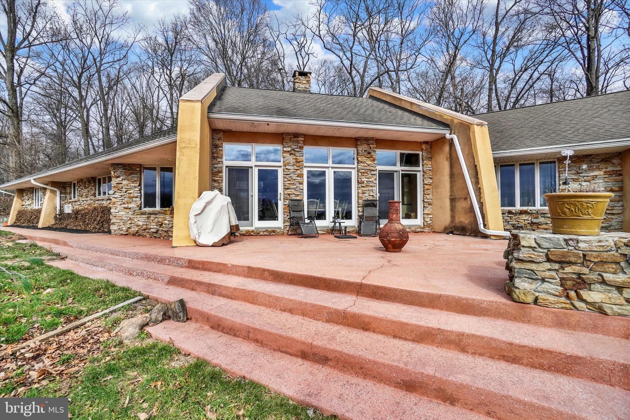 8272 Woodbine Road Airville, PA 17302 - Photo 12 of 68 a view of a house with backyard porch and sitting area