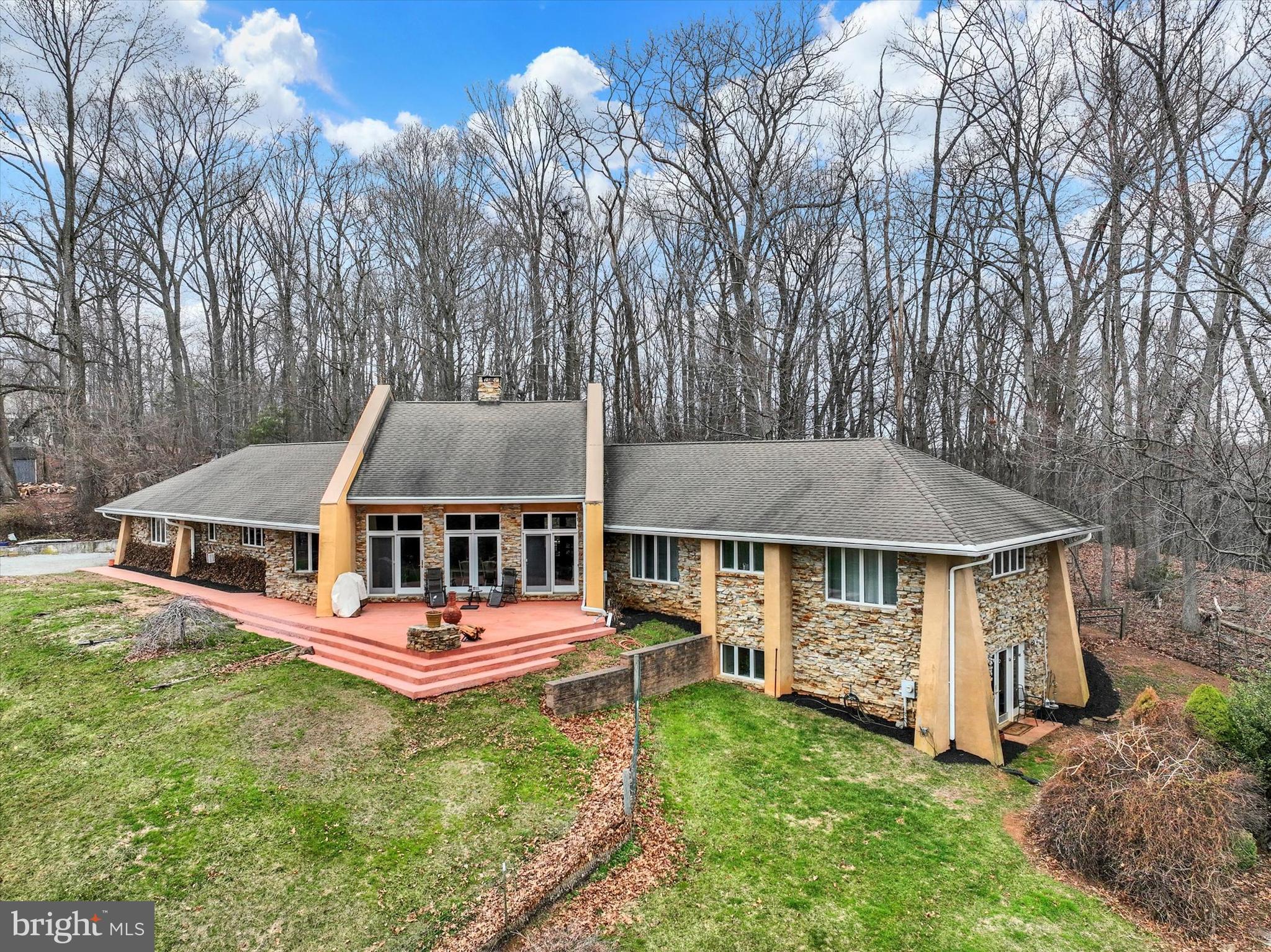8272 Woodbine Road Airville, PA 17302 - Photo 3 of 68 an aerial view of a house with a yard table and chairs
