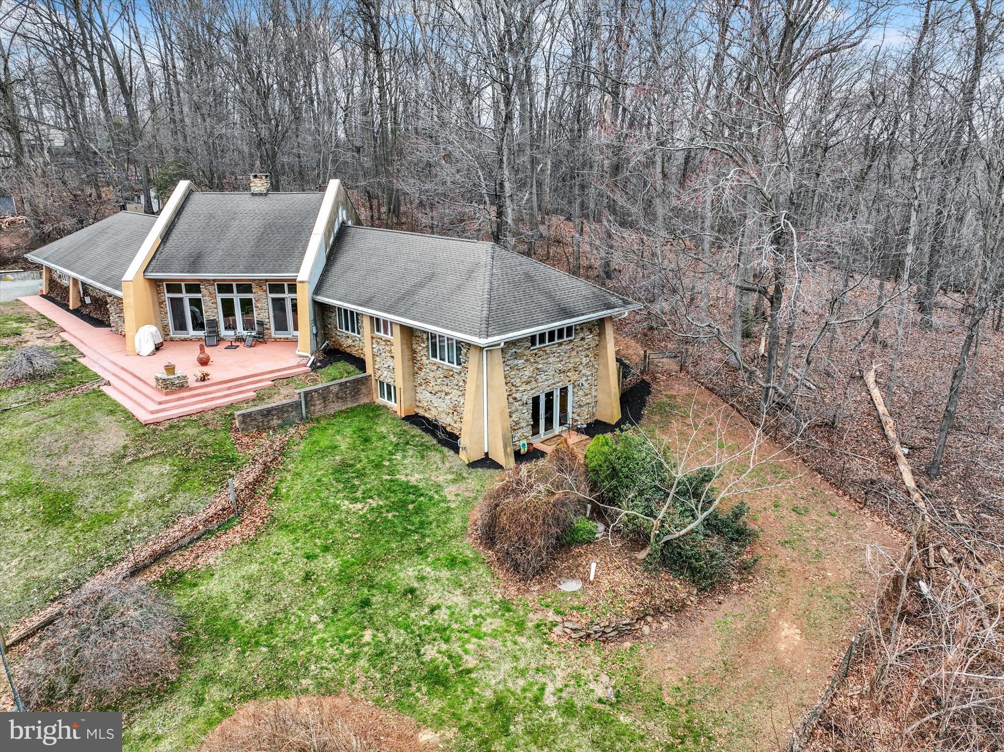 8272 Woodbine Road Airville, PA 17302 - Photo 39 of 68 an aerial view of a house with a yard table and chairs